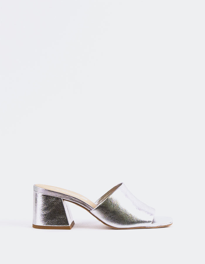 Effortless Block Heel Mule

This block heel mule combines modern sophistication with everyday comfort. Featuring a sturdy, square block heel for added stability and a sleek open-back design, it offers both style and ease of wear. The minimalistic silhouette makes it perfect for pairing with a variety of outfits, from casual jeans to more polished workwear. With its balance of elegance and practicality, this mule is the perfect addition to any wardrobe.

Detail(s):&nbsp;

Square Toe

2.5”&nbsp; Block Heel

W