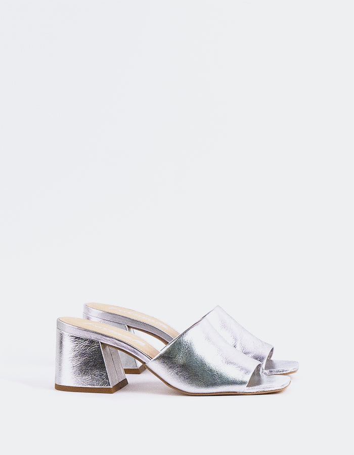 Effortless Block Heel Mule

This block heel mule combines modern sophistication with everyday comfort. Featuring a sturdy, square block heel for added stability and a sleek open-back design, it offers both style and ease of wear. The minimalistic silhouette makes it perfect for pairing with a variety of outfits, from casual jeans to more polished workwear. With its balance of elegance and practicality, this mule is the perfect addition to any wardrobe.

Detail(s):&nbsp;

Square Toe

2.5”&nbsp; Block Heel

W