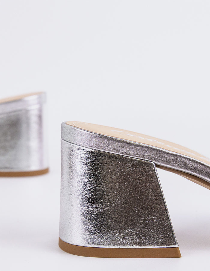 Effortless Block Heel Mule

This block heel mule combines modern sophistication with everyday comfort. Featuring a sturdy, square block heel for added stability and a sleek open-back design, it offers both style and ease of wear. The minimalistic silhouette makes it perfect for pairing with a variety of outfits, from casual jeans to more polished workwear. With its balance of elegance and practicality, this mule is the perfect addition to any wardrobe.

Detail(s):&nbsp;

Square Toe

2.5”&nbsp; Block Heel

W