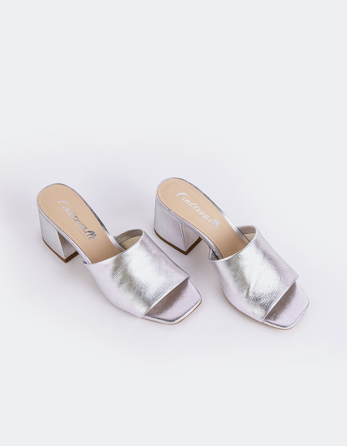 Effortless Block Heel Mule

This block heel mule combines modern sophistication with everyday comfort. Featuring a sturdy, square block heel for added stability and a sleek open-back design, it offers both style and ease of wear. The minimalistic silhouette makes it perfect for pairing with a variety of outfits, from casual jeans to more polished workwear. With its balance of elegance and practicality, this mule is the perfect addition to any wardrobe.

Detail(s):&nbsp;

Square Toe

2.5”&nbsp; Block Heel

W